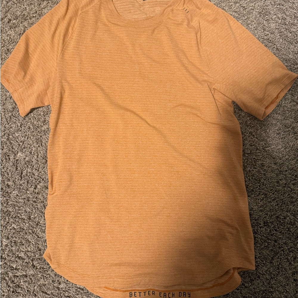 lululemon athletica Men's Short Sleeve Tee in Orange barley worn